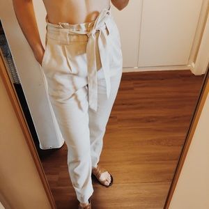 Cream Dress pant with snatched bag waist.
